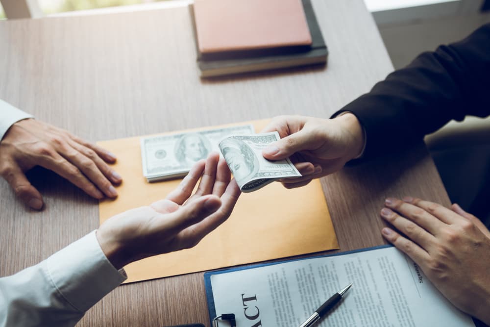 Person receiving money from a mediator