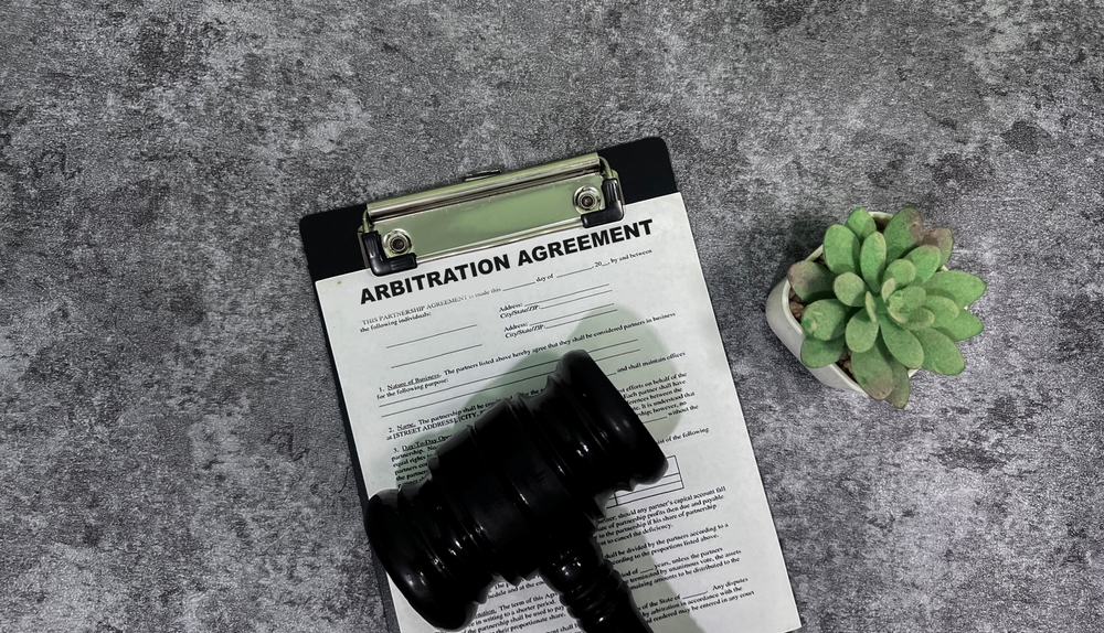 Arbitration agreement document with a gavel representing a formal arbitration process