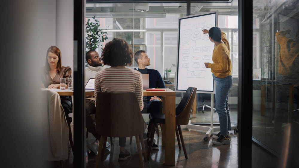 Employees participating in a structured workplace conversation to address conflict and improve communication