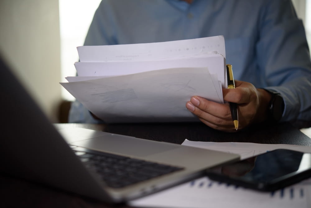 Attorney reviewing case documents to prepare for mediation