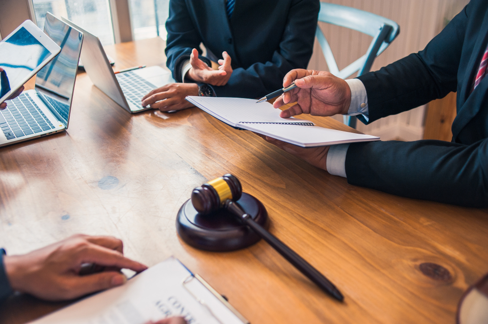 Lawyers discussing strategy before mediation meeting